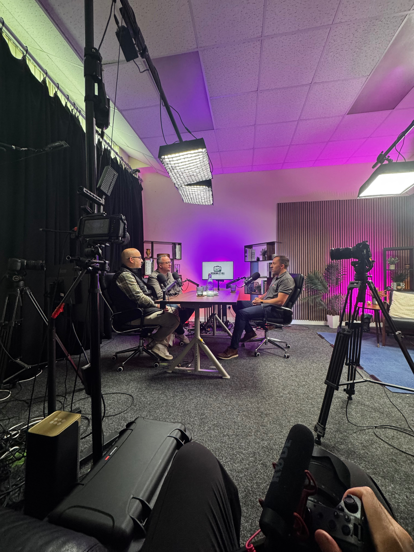 Behind the camera at a podcast studio shoot